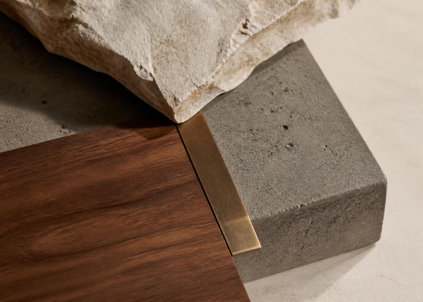 Stone, concrete, walnut and bronze arranged as a material study